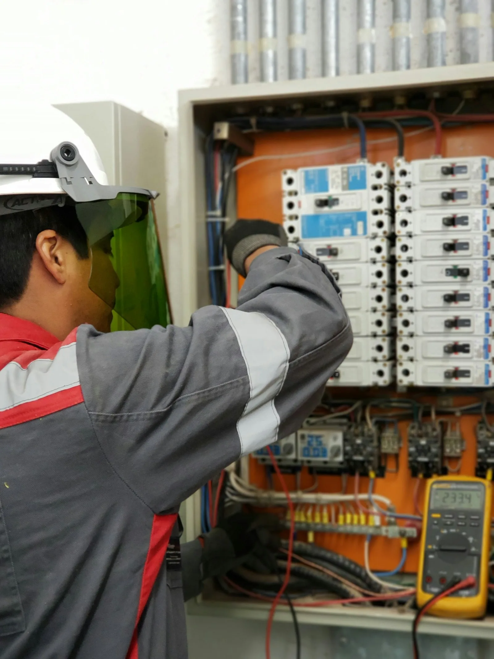 Professional electrician working on a residential electrical panel in Toronto